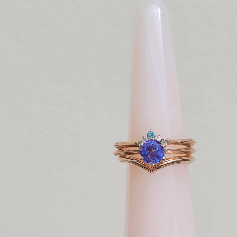 Blossom ethically made Rose gold Organic Dew Drop Purple Sapphire Solitaire Engagement Ring with shaped 5 green tourmaline gemstone Caress eternity ring Diamonds by Emma Hedley wishbone wedding pink ring cone