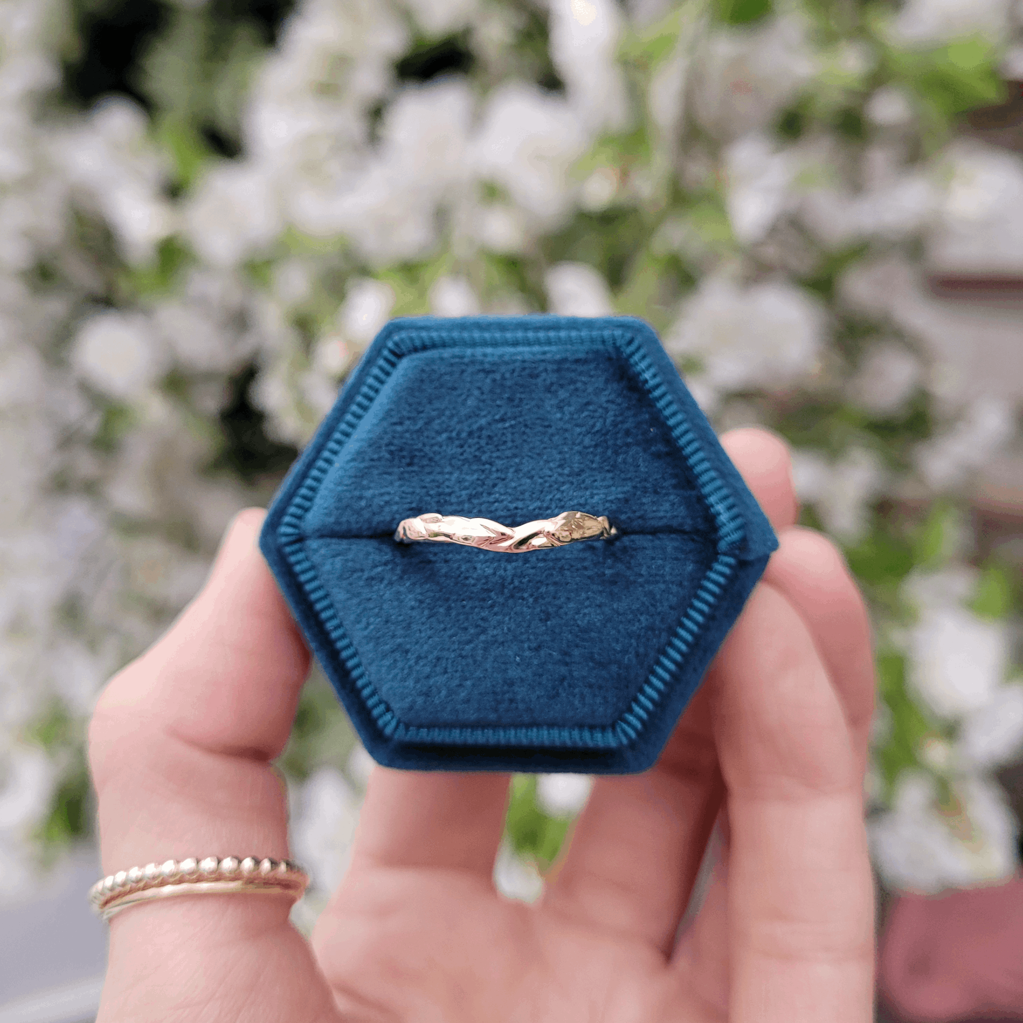 Forest Wishbone Leaf Textured Wedding Ring in a hexagon teal velvet vintage style ring box by Emma Hedley Jeweller Newcastle Upon Tyne