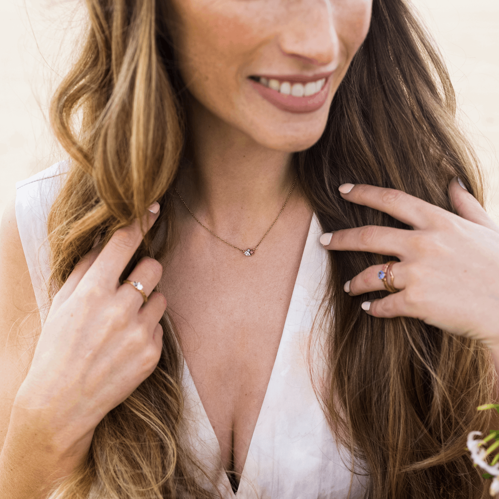 Rose gold blossom cluster gemstone pendant pink green sapphire tourmaline diamond 3 stone necklace by fine jewellery designer Emma Hedley Photography by Claire Collinson