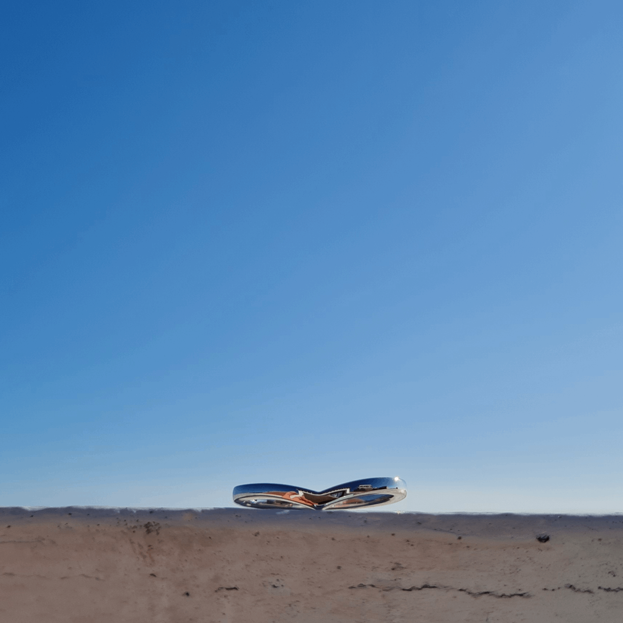 vibrant Blue sky with Classic platinum wishbone wedding ring by Emma Hedley Jewellery