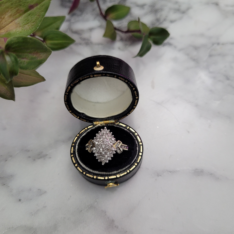 top view vintage diamond cluster ring in a vintage ring box marquise shaped cluster ring 9ct yellow gold tapered baguette diamond set shoulders