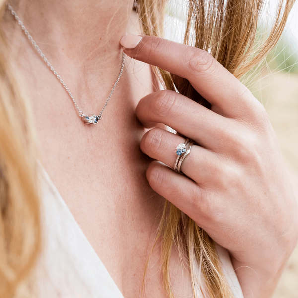 Classic platinum wishbone wedding ring blue green 3 stone organic cluster engagement ring and matching pendant Emma Hedley fine jewellery Claire Collinson Photography
