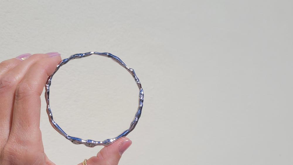 Melted Bangle in Sterling Silver in Woman's Hand - Emma Hedley British Fine Jewellery Designer