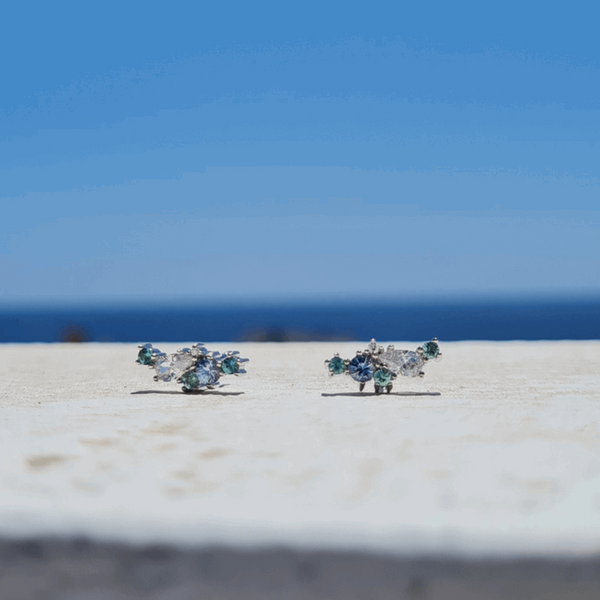 Ocean_constellation_stud_earrings_set_with_blue_sapphire_seafoam_pastel_tourmalines_and_white_diamonds_set_in_9ct_recycled_white_gold_Emma_Hedley_Jewellery_ cluster