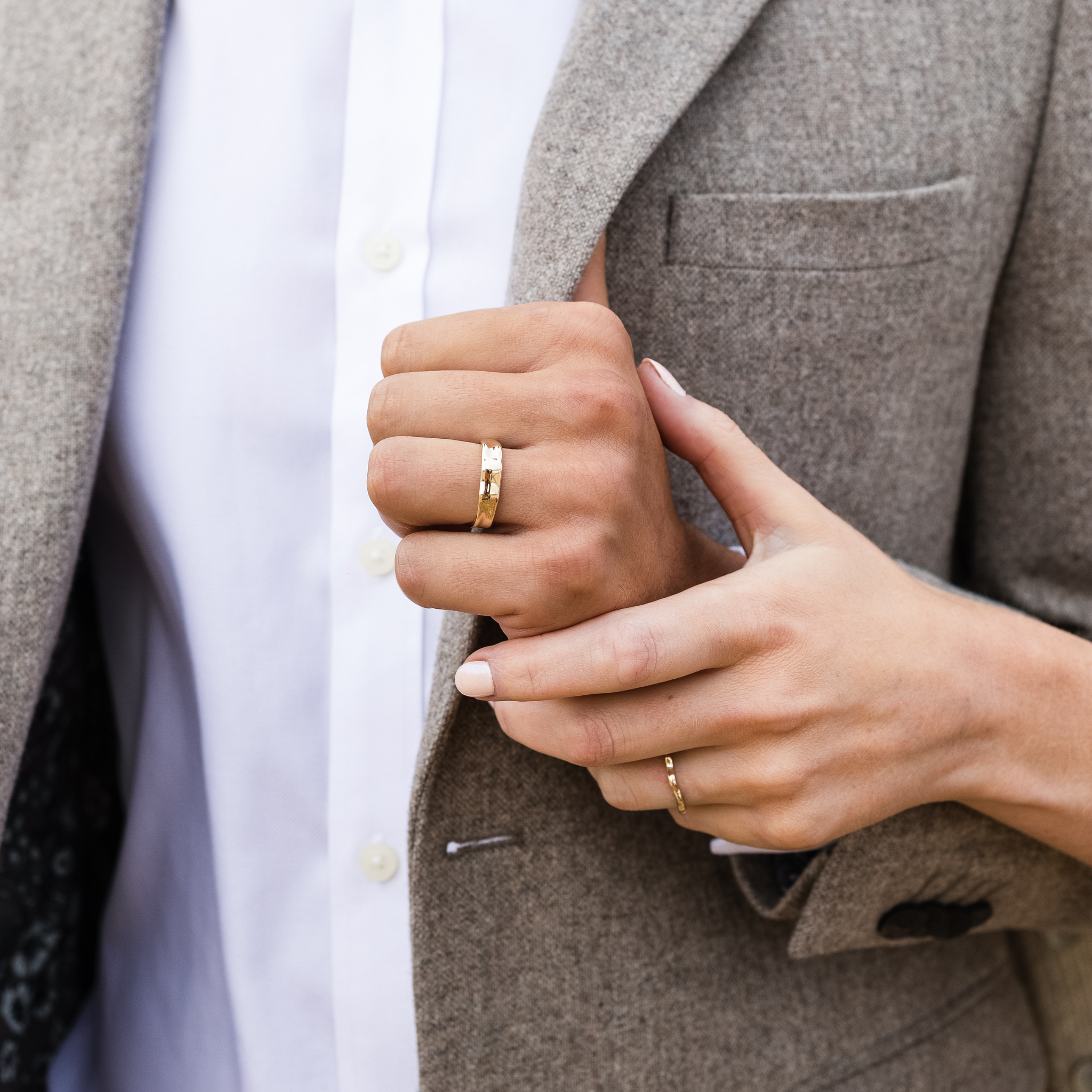 Ripple Wedding rings 2mm and 5mm recycled yellow gold unique wedding rings unisex male and female by Designer Emma Hedley Claire Collinson Photography